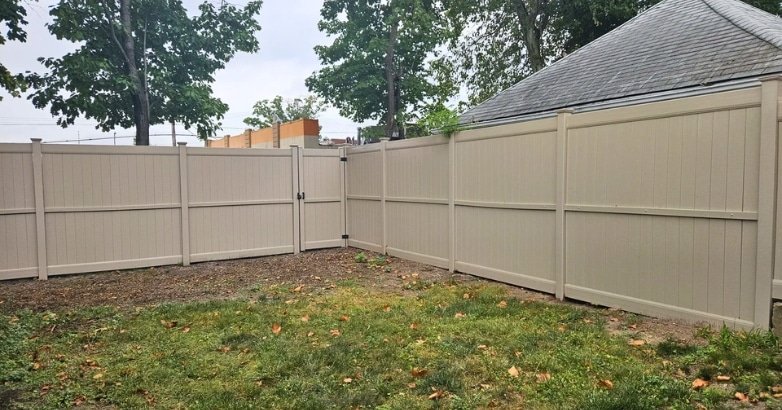 A newly installed fence in a backyard, showcasing custom fencing options for New Jersey homes with flexible heights and layouts.