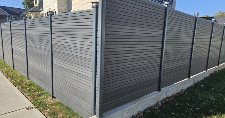 A durable fence combining wood and steel, designed for lasting quality in custom fencing for New Jersey residences.