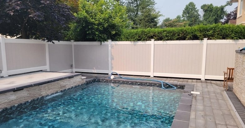  A pool enclosed by a sturdy fence, highlighting the benefits of enhancing property value with quality fencing.