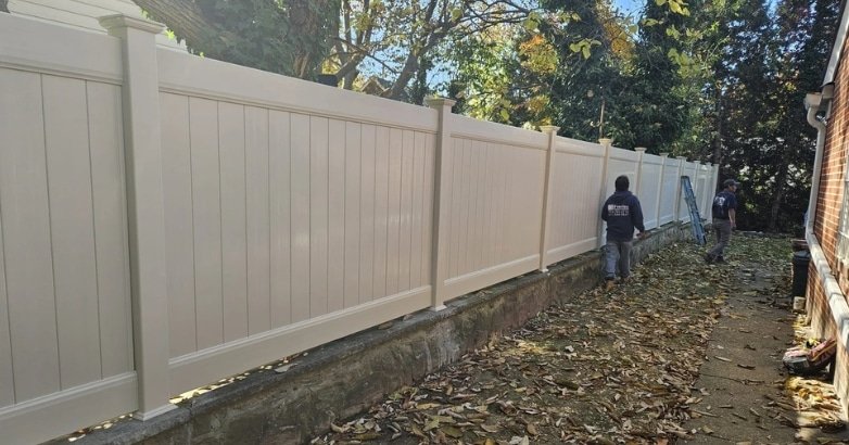 Emergency Fence Repairs DIY Fence Repairs vs. Professional A residential neighborhood scene shows a fence being installed, emphasizing the differences between DIY and professional fence repairs.